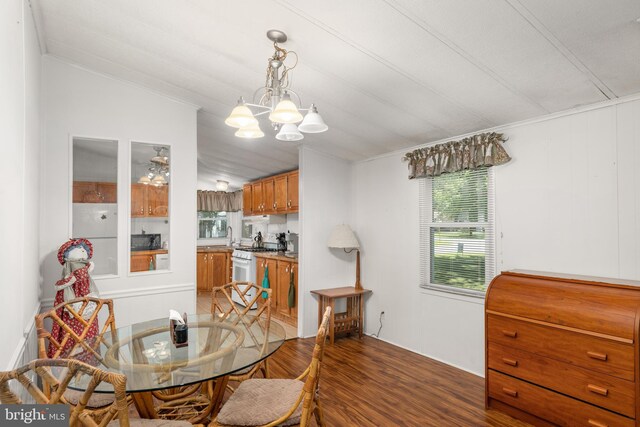 27846 Lord Calvert Dr, Millsboro, DE 19966 - dining area featuring light wood-type flooring, vaulted ceiling, and a chandelier