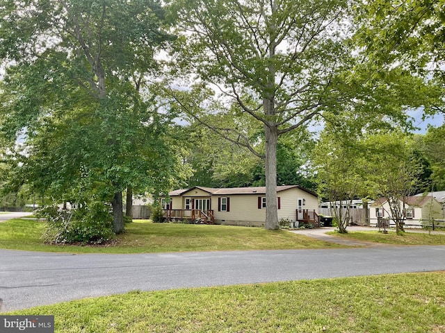 27846 Lord Calvert Dr, Millsboro, DE 19966 - manufactured / mobile home featuring a front yard, crawl space, and asphalt driveway