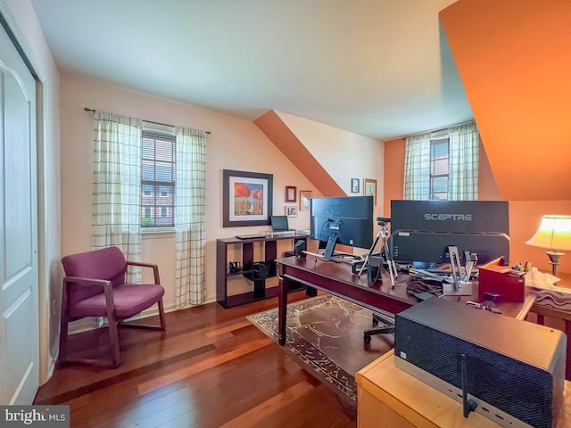 home office with plenty of natural light, wood finished floors, and baseboards