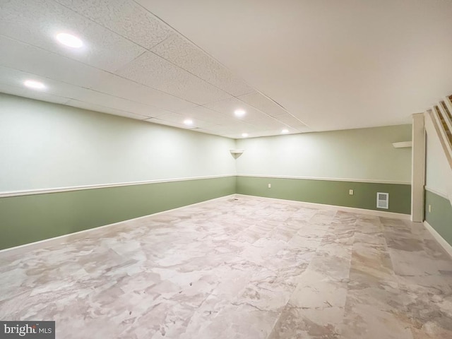 finished basement featuring recessed lighting and baseboards