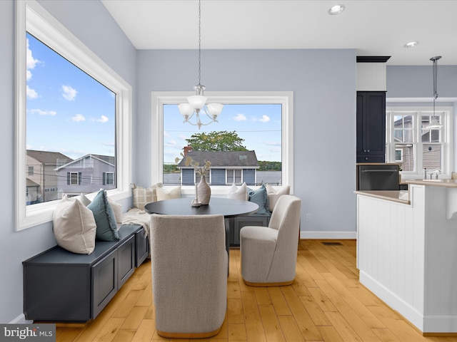 7839 Denton Ave, Baltimore, MD 21219 - dining space with a chandelier, light wood-style flooring, baseboards, and recessed lighting