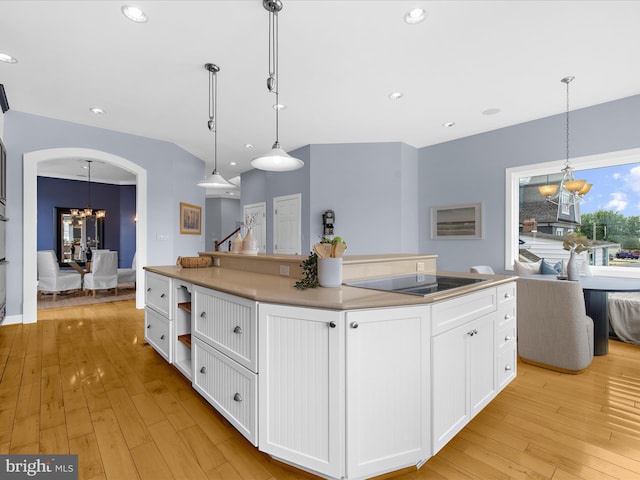 7839 Denton Ave, Baltimore, MD 21219 - kitchen featuring a chandelier, black electric stovetop, white cabinets, light wood-style flooring, and recessed lighting