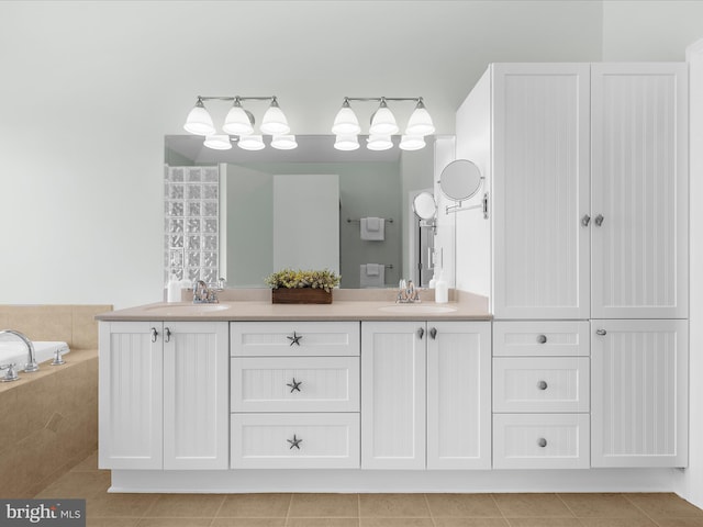 7839 Denton Ave, Baltimore, MD 21219 - bathroom featuring tile patterned floors, double vanity, and tiled bath