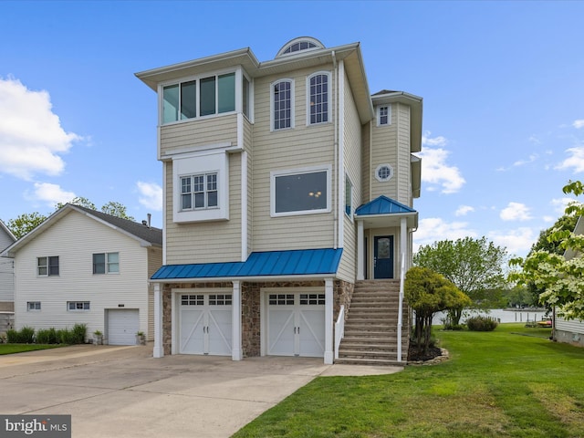 7839 Denton Ave, Baltimore, MD 21219 - coastal inspired home with concrete driveway, stone siding, a standing seam roof, and a front yard