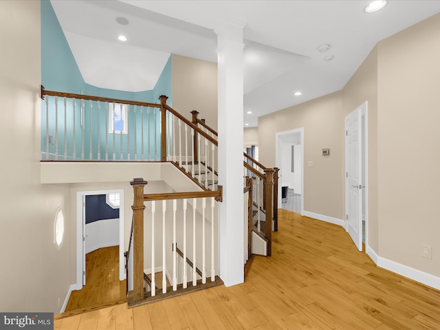 7839 Denton Ave, Baltimore, MD 21219 - stairway featuring wood-type flooring, baseboards, and recessed lighting