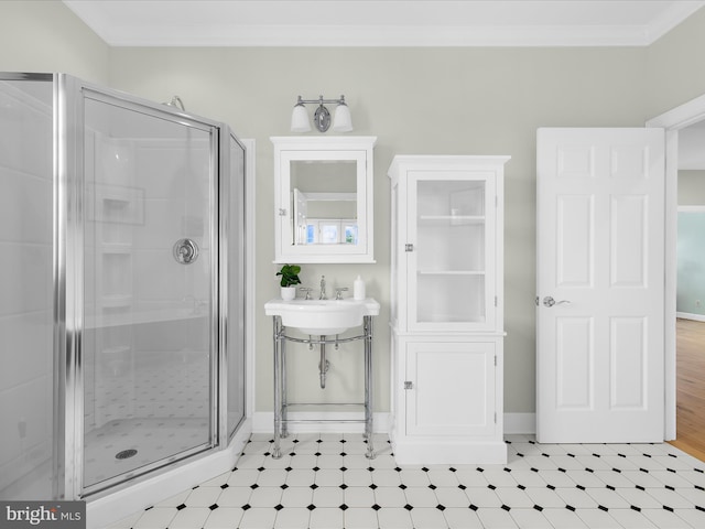 7839 Denton Ave, Baltimore, MD 21219 - bathroom featuring a stall shower, crown molding, baseboards, and a sink