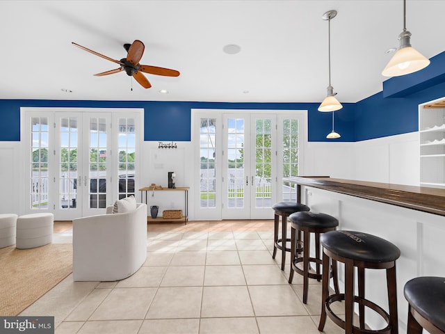 7839 Denton Ave, Baltimore, MD 21219 - living area featuring french doors, ceiling fan, light tile patterned flooring, wainscoting, and recessed lighting