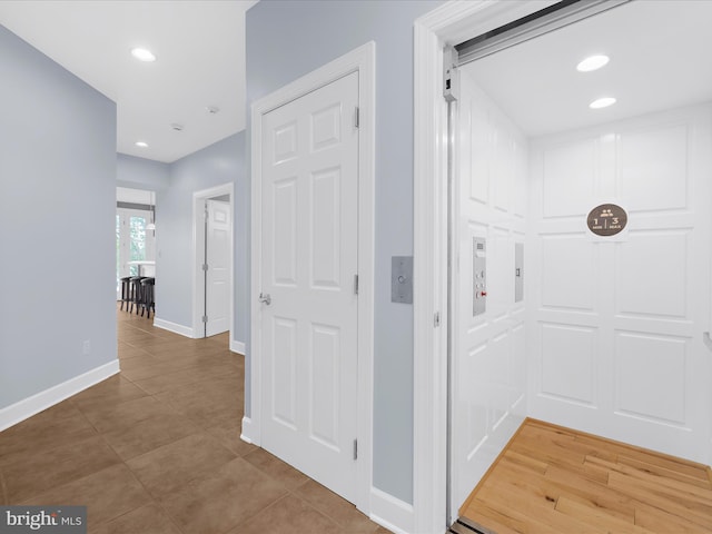 7839 Denton Ave, Baltimore, MD 21219 - corridor featuring baseboards, light tile patterned floors, and recessed lighting