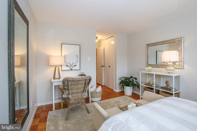 bedroom with baseboards and a closet