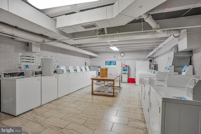 shared laundry room with washer and dryer