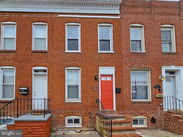 view of front of home featuring brick siding and entry steps