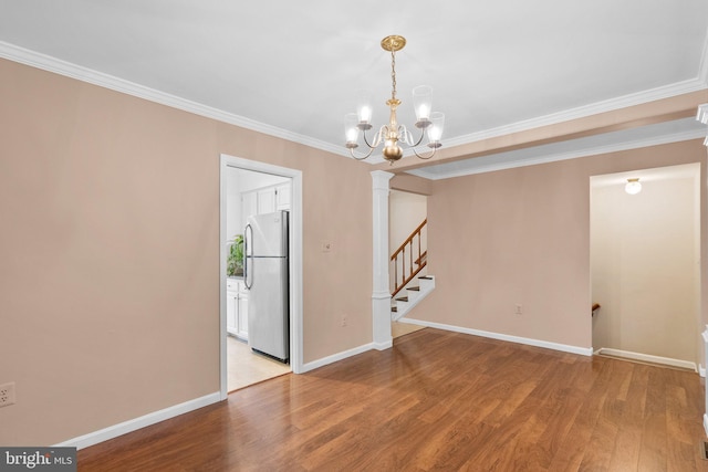 4849 Carriagepark Rd, Fairfax, VA 22032 - unfurnished room featuring wood finished floors, crown molding, stairway, baseboards, and a chandelier