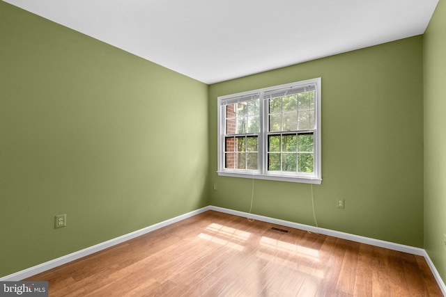 4849 Carriagepark Rd, Fairfax, VA 22032 - spare room with baseboards and wood finished floors