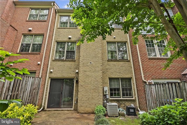 4849 Carriagepark Rd, Fairfax, VA 22032 - view of building exterior featuring central AC unit and fence