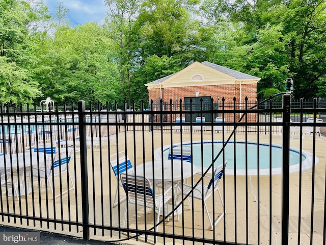 4849 Carriagepark Rd, Fairfax, VA 22032 - community pool featuring fence and view of scattered trees