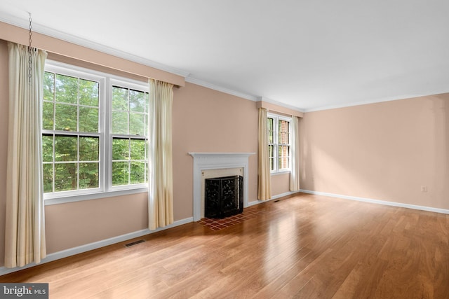 4849 Carriagepark Rd, Fairfax, VA 22032 - unfurnished living room with light wood-style flooring, a fireplace with flush hearth, baseboards, and crown molding