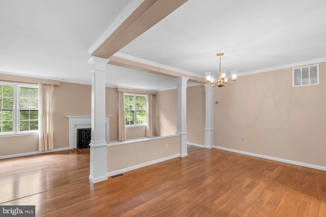 4849 Carriagepark Rd, Fairfax, VA 22032 - unfurnished living room with crown molding, a chandelier, ornate columns, wood finished floors, and a fireplace