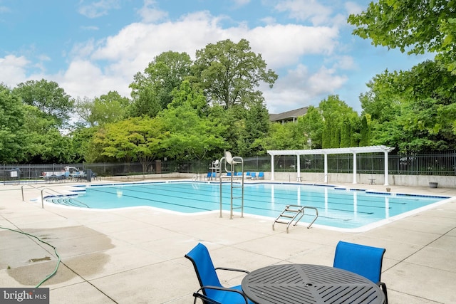 4415 Weatherington Ln Unit 401, Fairfax, VA 22030 - community pool with a patio and view of scattered trees