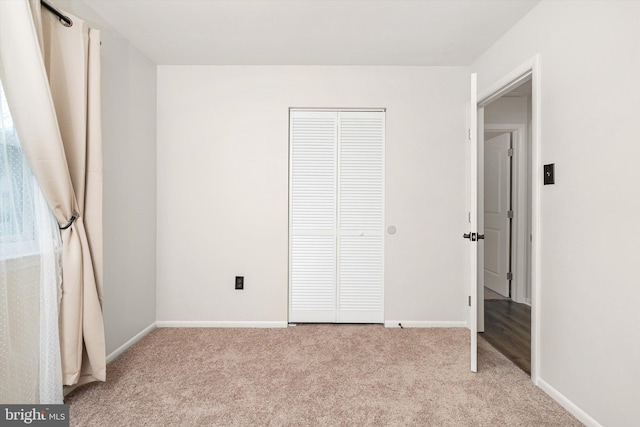 203 Coville Dr, Browns Mills, NJ 08015 - unfurnished bedroom with light colored carpet, baseboards, and a closet
