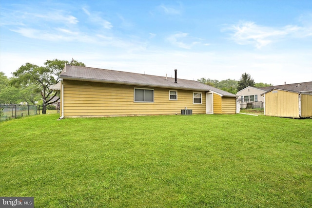 203 Coville Dr, Browns Mills, NJ 08015 - rear view of property featuring central air condition unit, a shed, and an outbuilding