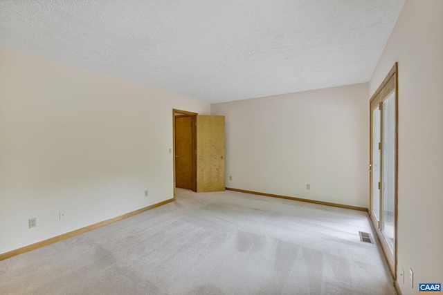 7 Spoon Ter, Palmyra, VA 22963 - unfurnished room featuring a textured ceiling, light colored carpet, and baseboards