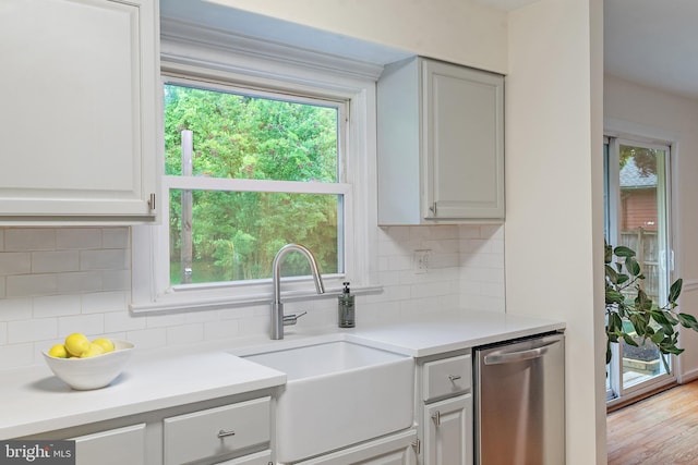 1808 Bay Ridge Ave, Annapolis, MD 21403 - kitchen featuring a sink, dishwasher, tasteful backsplash, and plenty of natural light