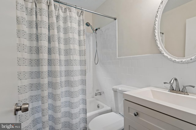 1808 Bay Ridge Ave, Annapolis, MD 21403 - full bathroom featuring tile walls, shower / bath combo, toilet, and vanity