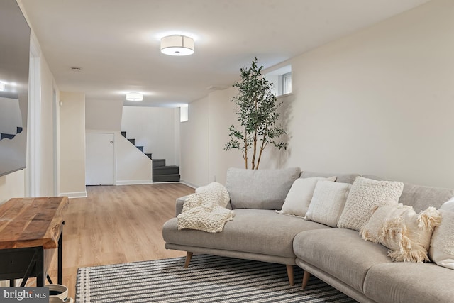 1808 Bay Ridge Ave, Annapolis, MD 21403 - living area with stairs, light wood finished floors, and baseboards