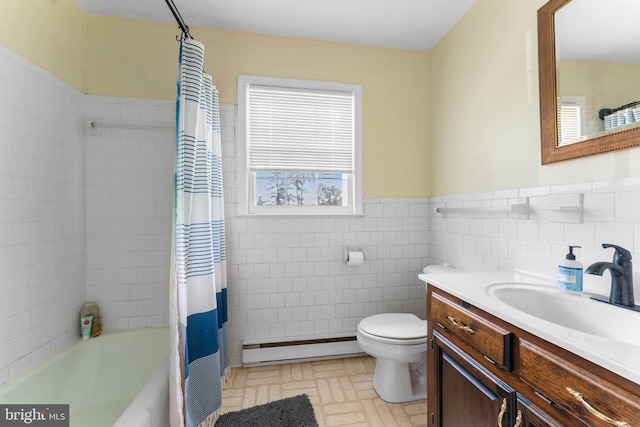 145 Harding Ln, Lottsburg, VA 22511 - full bathroom featuring a baseboard heating unit, toilet, tile walls, a wainscoted wall, and vanity