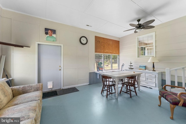 145 Harding Ln, Lottsburg, VA 22511 - dining space with a decorative wall, a ceiling fan, and finished concrete flooring