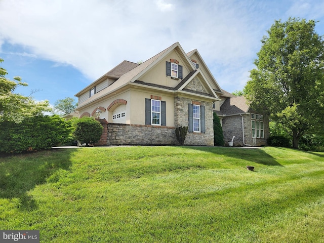 101 Heritage Rd, Lancaster, PA 17602 - view of front of property with stone siding, stucco siding, and a front yard