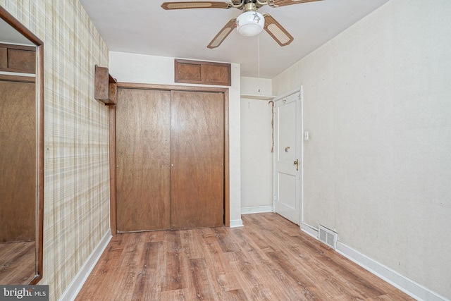 3311 Meridian St, Philadelphia, PA 19136 - unfurnished bedroom with wood finished floors, baseboards, a closet, and a ceiling fan