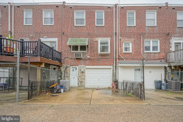 3311 Meridian St, Philadelphia, PA 19136 - rear view of property with central air condition unit, concrete driveway, and a garage