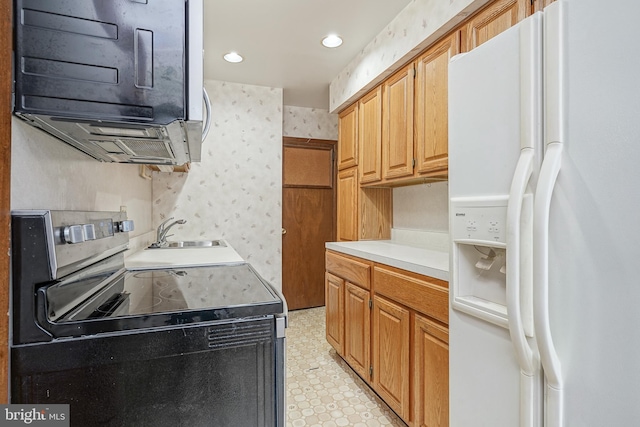 3311 Meridian St, Philadelphia, PA 19136 - kitchen with white refrigerator with ice dispenser, electric range, a sink, light floors, and wallpapered walls