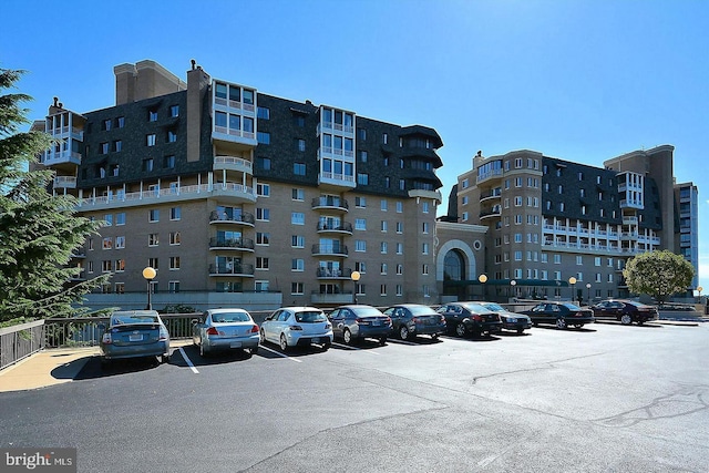 1250 S Washington St S Unit 207, Alexandria, VA 22314 - view of apartment building / complex with uncovered parking