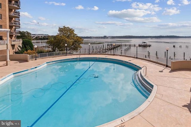 1250 S Washington St S Unit 207, Alexandria, VA 22314 - community pool with a water view, fence, and a patio area