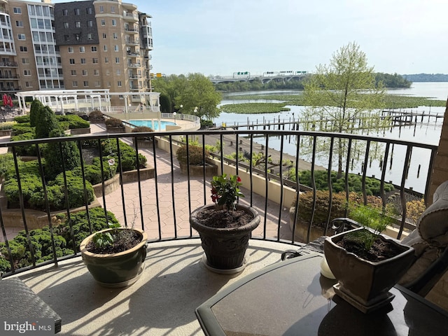 1250 S Washington St S Unit 207, Alexandria, VA 22314 - balcony with a water view and view of pool area