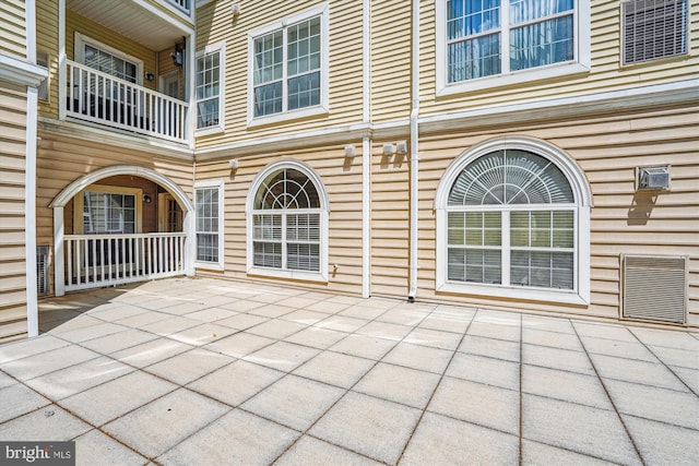 view of patio featuring a balcony