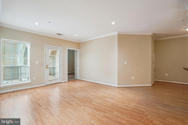 unfurnished room with light wood-type flooring, baseboards, crown molding, and recessed lighting