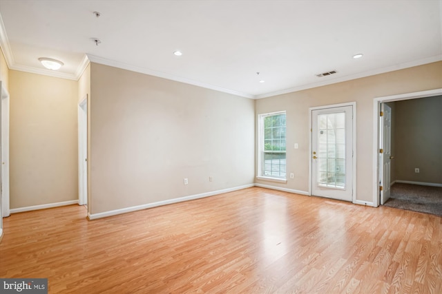 spare room featuring light wood-style flooring, baseboards, crown molding, fire sprinkler in ceiling, and recessed lighting