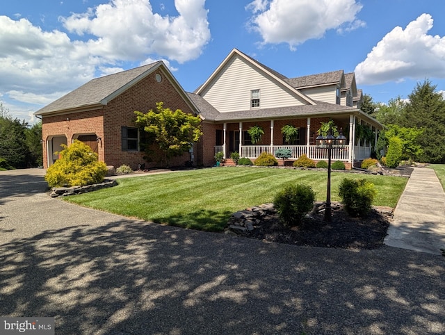 15920 River Bend Ct, Williamsport, MD 21795 - view of front of property featuring brick siding, a porch, a front lawn, and a garage