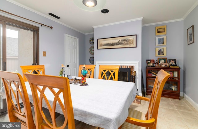 1644 Spring Mill Ct, Yardley, PA 19067 - dining space featuring ornamental molding, baseboards, light tile patterned flooring, and a fireplace