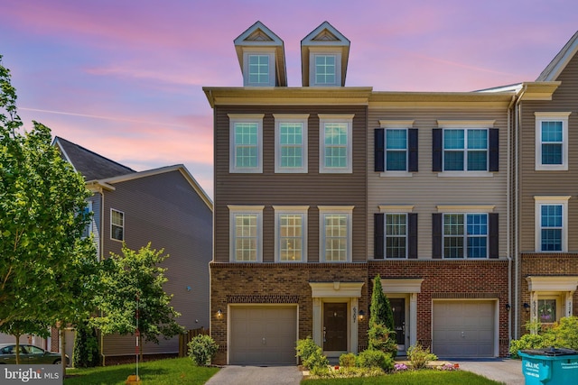 6207 Margarita Way, Frederick, MD 21703 - view of property with a garage, brick siding, and asphalt driveway