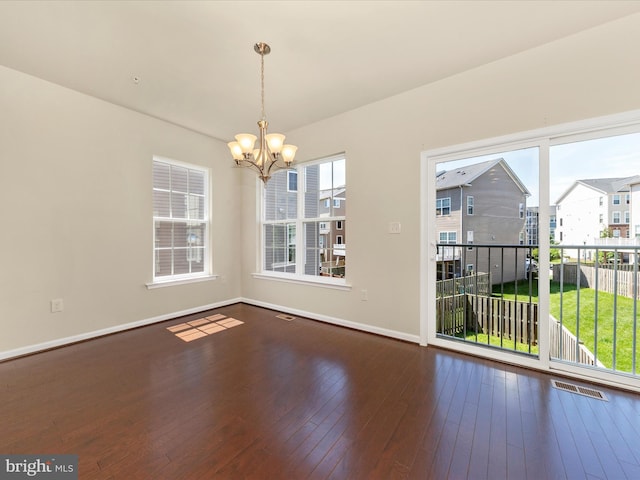 6207 Margarita Way, Frederick, MD 21703 - unfurnished dining area with a chandelier, baseboards, and wood-type flooring