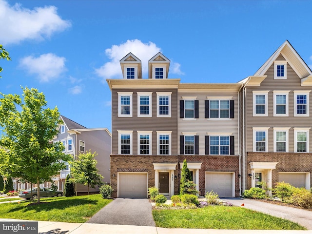6207 Margarita Way, Frederick, MD 21703 - townhome / multi-family property featuring driveway, an attached garage, and brick siding