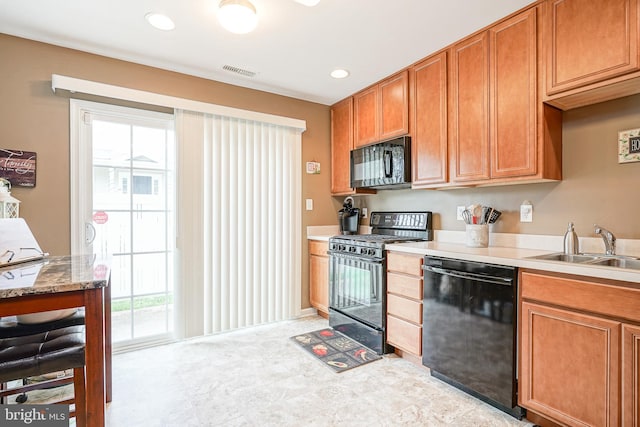 2501 Lexington Mews, Woolwich Twp, NJ 08085 - kitchen featuring black appliances, a sink, plenty of natural light, brown cabinetry, and recessed lighting