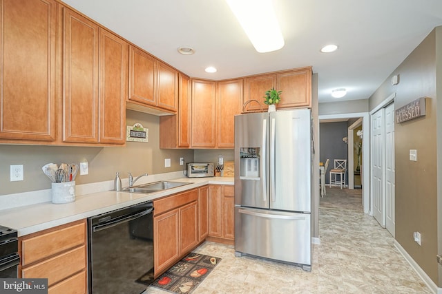 2501 Lexington Mews, Woolwich Twp, NJ 08085 - kitchen with stainless steel fridge, black dishwasher, a sink, light countertops, and recessed lighting