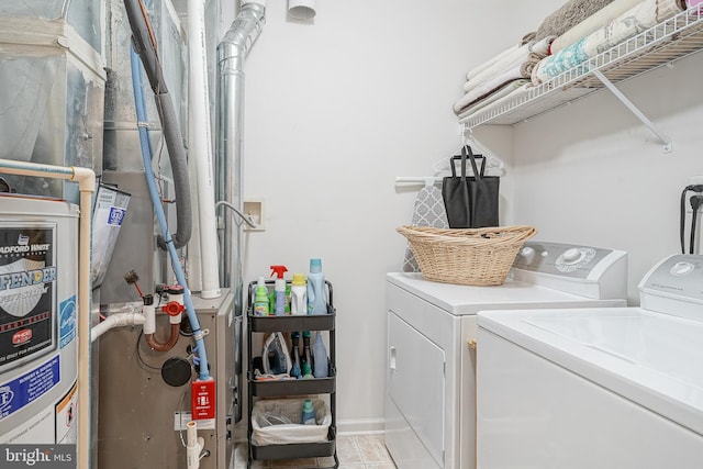 2501 Lexington Mews, Woolwich Twp, NJ 08085 - clothes washing area with washer and clothes dryer and light tile patterned floors