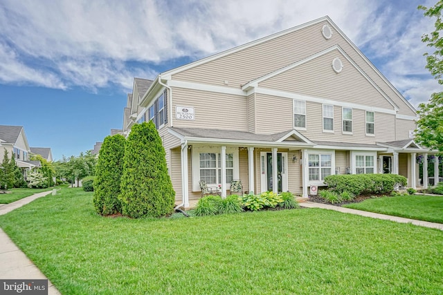 2501 Lexington Mews, Woolwich Twp, NJ 08085 - view of front of home featuring a porch and a front lawn