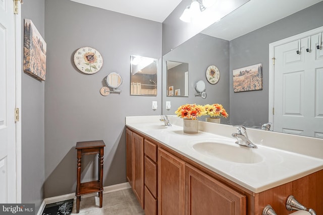 2501 Lexington Mews, Woolwich Twp, NJ 08085 - bathroom featuring double vanity, baseboards, and tile patterned floors